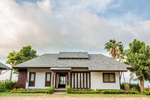 a house with a gray roof at 2H RESORT KOH SAMUI in Mae Nam