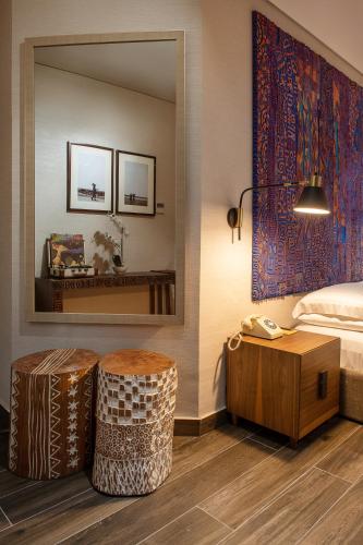 Ένα ή περισσότερα κρεβάτια σε δωμάτιο στο The White Orchid Hotel