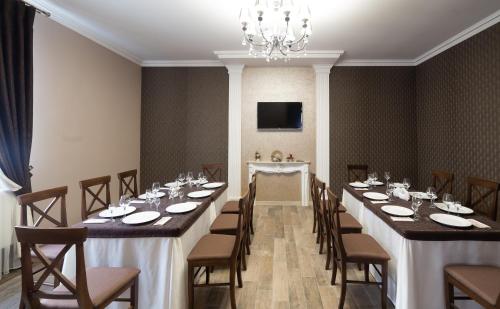 a large room with a long table and chairs at LeGrand in Stryi