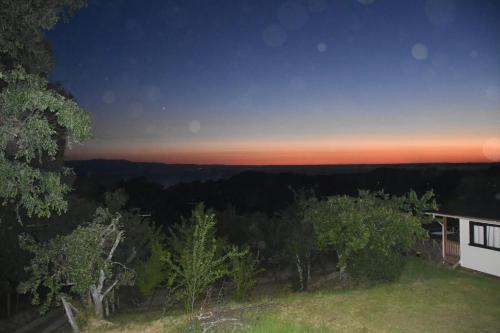 a view of the sunset from a house at El Granero de la Abuela in Futrono