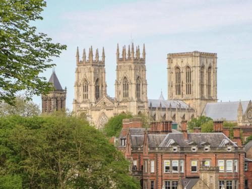 a view of cathedral and buildings in a city at Copmanthorpe Hall in York