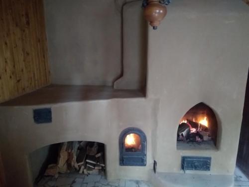 a model of a toy kitchen with two fireplaces at Chata Živa pod Babou horou in Oravská Polhora
