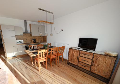 A kitchen or kitchenette at Appartementhaus Römerhof Superior - Kärnten Card Sommer inklusive