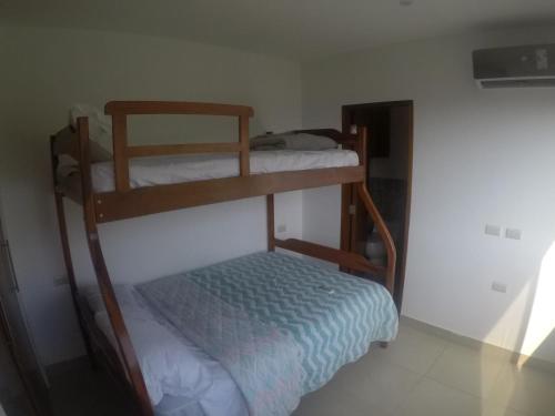 a room with two bunk beds in a room at The Heights in Montañita in Montañita