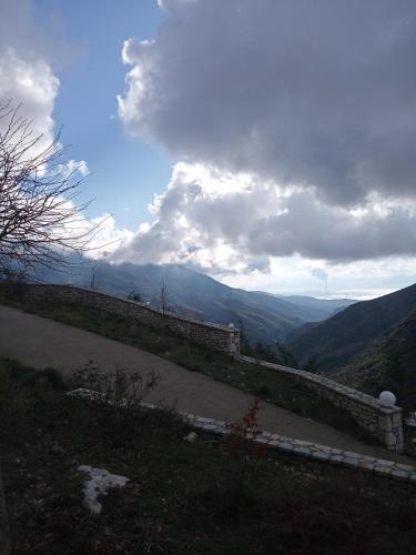 a view of the mountains from a hill with a road at Elova in Zátouna