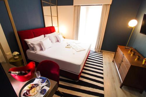 Кровать или кровати в номере Neo Hotel Boutique