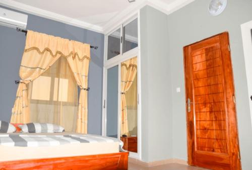 Giường trong phòng chung tại Villa Beach Avepozo Lome