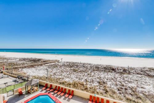 a view of the beach from the balcony of a resort at Phoenix Vacation Rentals in Orange Beach