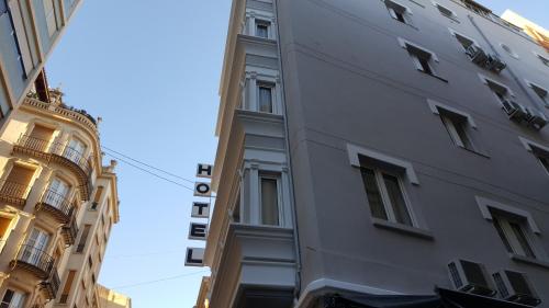 a building in the middle of two other buildings at Hotel Marítimo Urban in Alicante