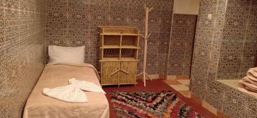 מיטה או מיטות בחדר ב-Riad White House