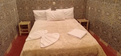 Łóżko lub łóżka w pokoju w obiekcie Riad White House