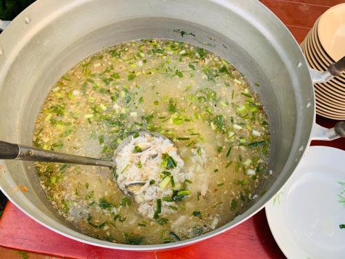 a pot of soup with a spoon in it at ศรีสุภาวดีรีสอร์ท-Srisupawadee resort in Prachuap Khiri Khan
