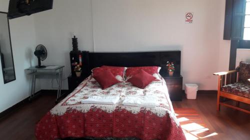 Postel nebo postele na pokoji v ubytování Hostal Cotroneo