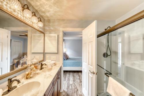 a bathroom with a sink and a shower and a mirror at 204 Dry Dock in Myrtle Beach