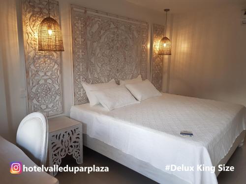 En eller flere senge i et værelse på Hotel Valledupar Plaza