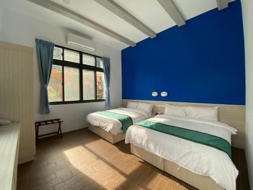 Ένα ή περισσότερα κρεβάτια σε δωμάτιο στο Lorna Resort