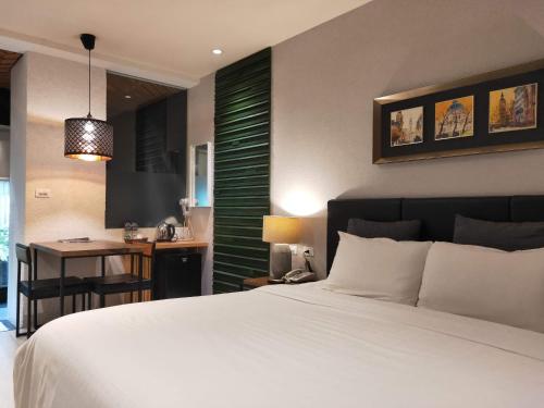Ένα ή περισσότερα κρεβάτια σε δωμάτιο στο Roppongi Motel
