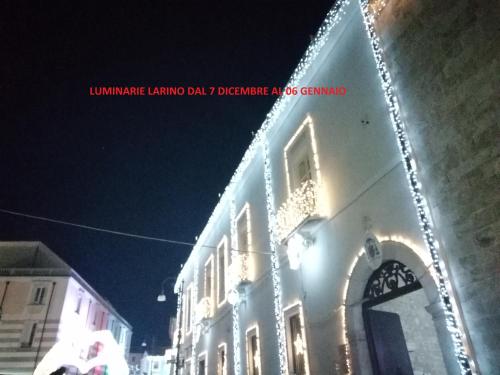 a building with christmas lights on the side of it at Valerio's Home Historical Center in Larino
