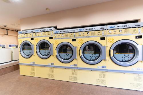 a row of washing machines in a store at HOTEL CITY INN WAKAYAMA Wakayama-Ekimae in Wakayama