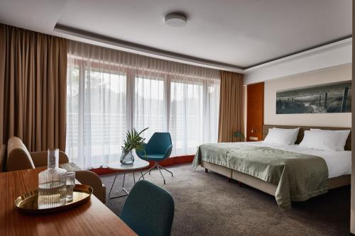 Posteľ alebo postele v izbe v ubytovaní Hotel Dom Zdrojowy Resort & SPA - Destigo Hotels