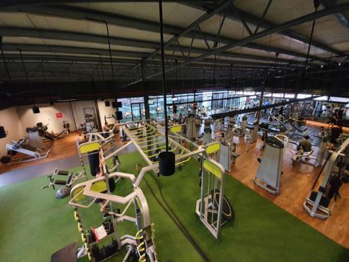 an overhead view of a gym with people exercising on machines at ARENA Boutique Hotel Kuala Terengganu in Kuala Terengganu