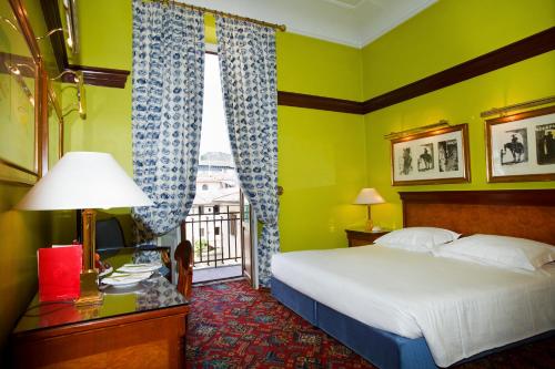 Postel nebo postele na pokoji v ubytování Hotel Albani Firenze