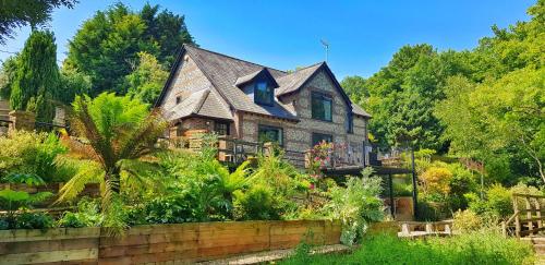 an old house with a garden in front of it at Waterfield House B&B in Dorchester