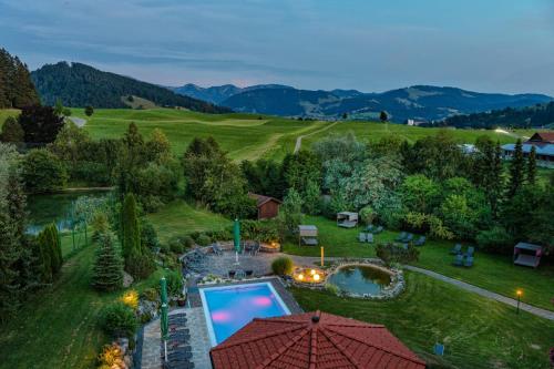 an aerial view of a backyard with a pool and a garden at Dein Engel in Oberstaufen
