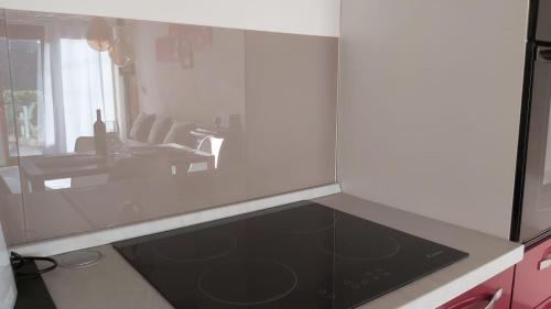a kitchen with a view of a living room at La Limonaia Country House in Monteriggioni