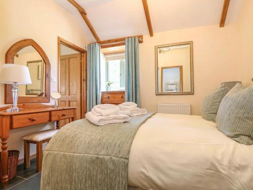 Säng eller sängar i ett rum på Beech Cottage