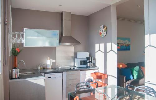 a kitchen with a sink and a counter top at Feel at Sants Apartments in Barcelona