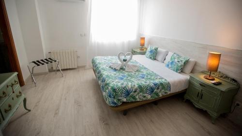 Katil atau katil-katil dalam bilik di Hostal Escala Suites