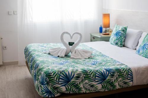 Katil atau katil-katil dalam bilik di Hostal Escala Suites