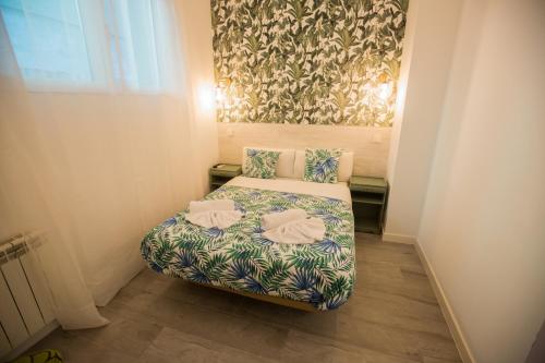 Katil atau katil-katil dalam bilik di Hostal Escala Suites