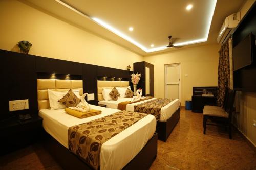 Un ou plusieurs lits dans un hébergement de l'établissement Hotel Ragavendra Rameswaram
