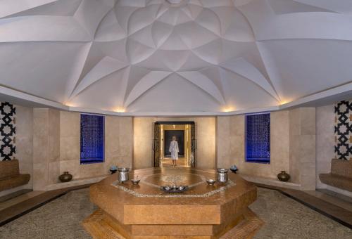 a large room with a large ceiling at Anantara Qasr al Sarab Desert Resort in Jurayrah