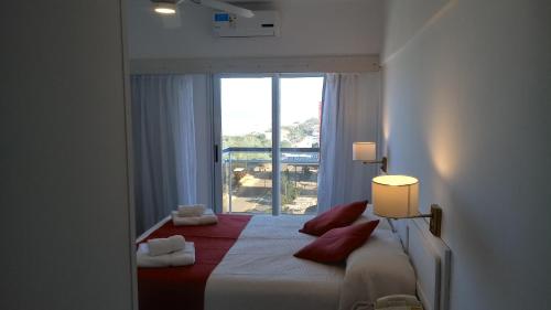 A bed or beds in a room at Gran Hotel Fontainebleau