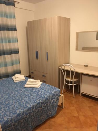 Ένα ή περισσότερα κρεβάτια σε δωμάτιο στο La stanzetta dì Lulu’