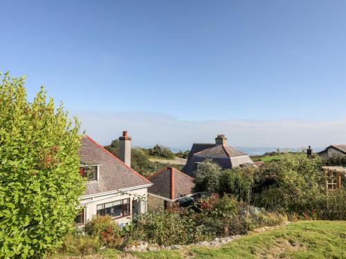 a group of houses on a hill at Casita in Benllech