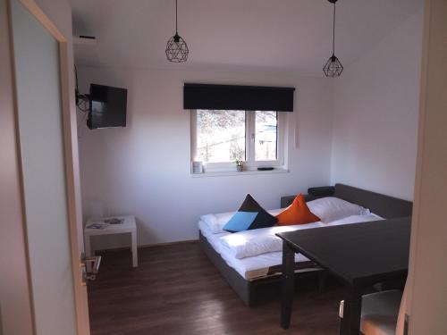 a living room with a couch and a table at Ferienwohnung Sauer in Blaichach