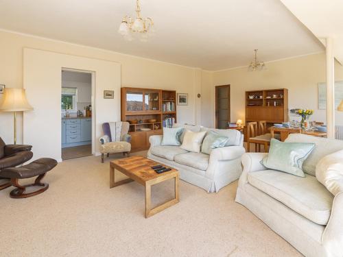 a living room with two couches and a coffee table at 5 Fairhaven in Salcombe