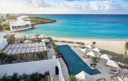 an aerial view of a resort with a swimming pool and the beach at Cap Juluca, A Belmond Hotel, Anguilla in West End Village