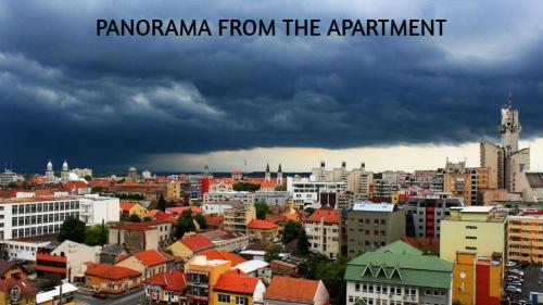 a view of a city with a cloudy sky at Panorama Apartament Plaza Tower in Satu Mare