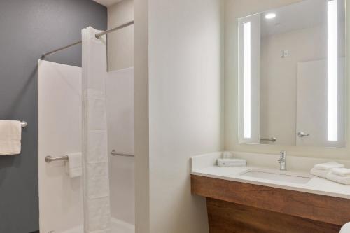 a bathroom with a sink and a mirror at Extended Stay America Premier Suites - Phoenix - Chandler - Downtown in Chandler