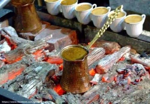 a bunch of food on a grill with a pot of sauce at CASA LELA 1...όπως μια φορά...like once in Míloi