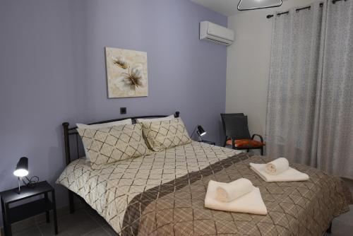 Postel nebo postele na pokoji v ubytování Katsaros - Elegant Home in Nafplio