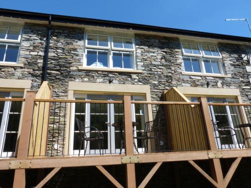 a wooden deck in front of a building at Frost in Ambleside