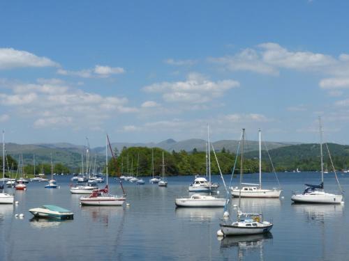 a large group of boats in a large body of water at Frost in Ambleside