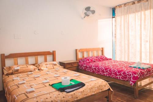 Postel nebo postele na pokoji v ubytování HOSPEDAJE LOS PAREDONES