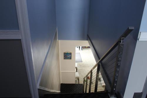 a stairway with blue walls and a blue wall at The Atlantic House in Narragansett